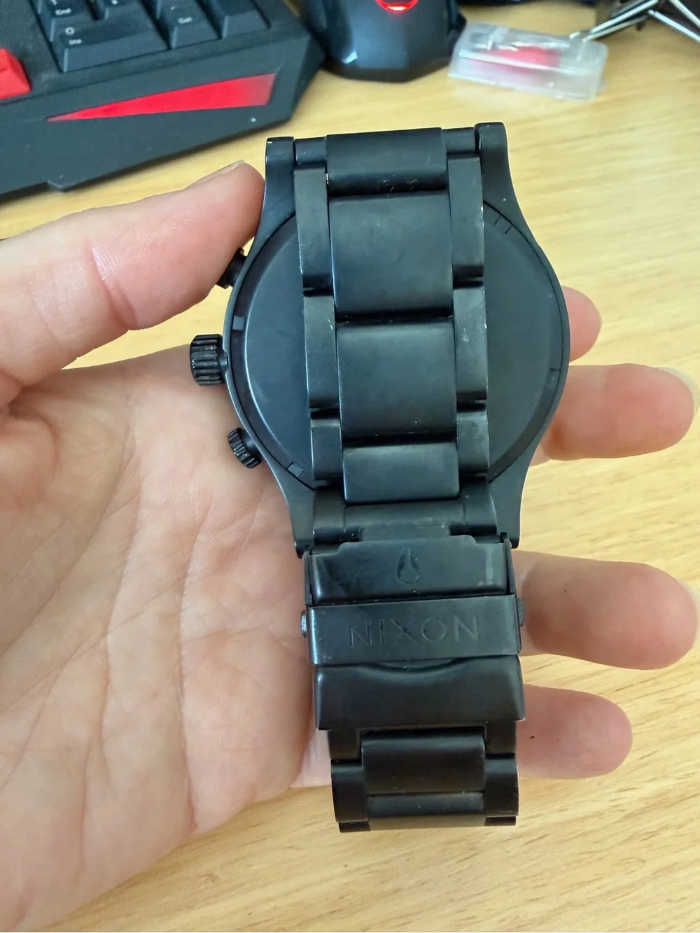 Nixon Black Chronograph Watch with Rose Gold Accents